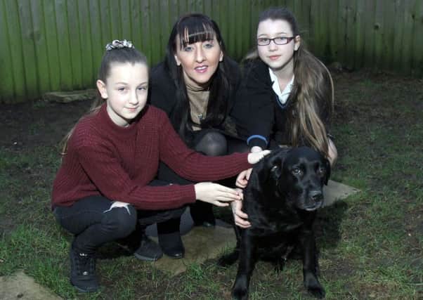 Emma Sheppard with her daughters Elisha aged 11 and Bethany aged 14 and their dog Jess