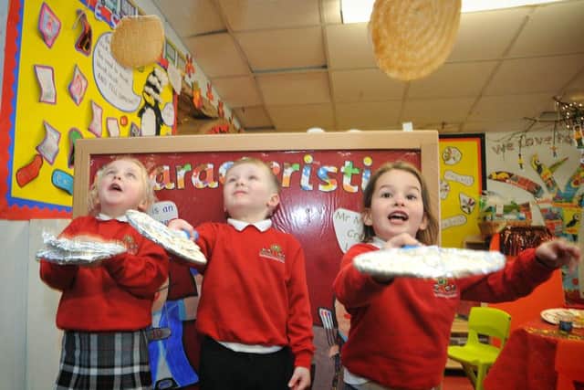 Pupils at Hambleton Primary Academy prepared for Shrove Tuesday with some pancake making and tossing. Pancake tossing are L-R: Molly Thompson, Max Whiteside and Freya Farrington.
