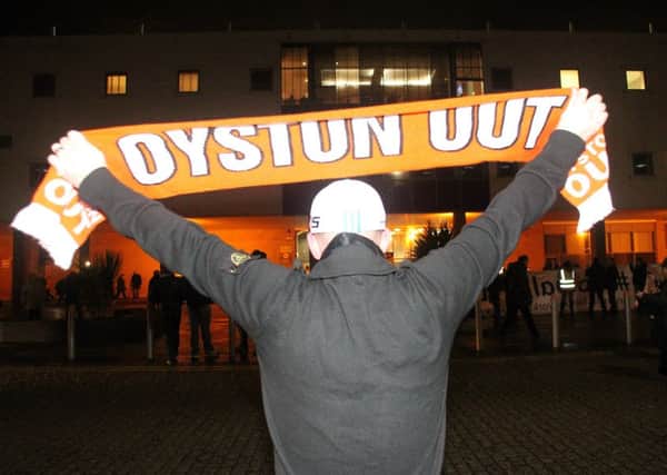 A fan during a protest outside of Bloomfield Road
