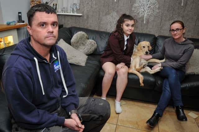 Mark with wife Janine, daughter Sophie (13) and Isla the dog