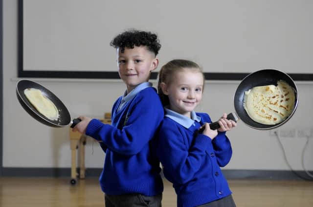 Children from Layton Primary School learn to make pancakes.  Pictured is Thaysezian Rainey and Maycee Atkinson.