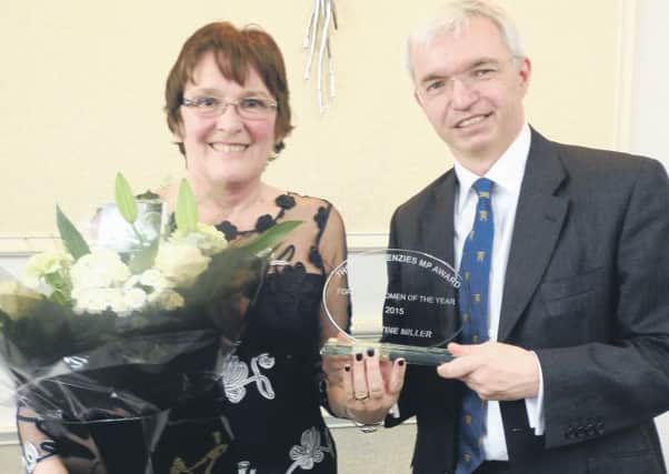 Fylde Woman of the Year awards 2015: inner Christine Miller receives her prize from Mark Menzies MP