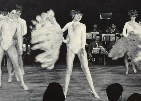 Cilla Black onstage dancing, picture taken from programme signed for Barry Band