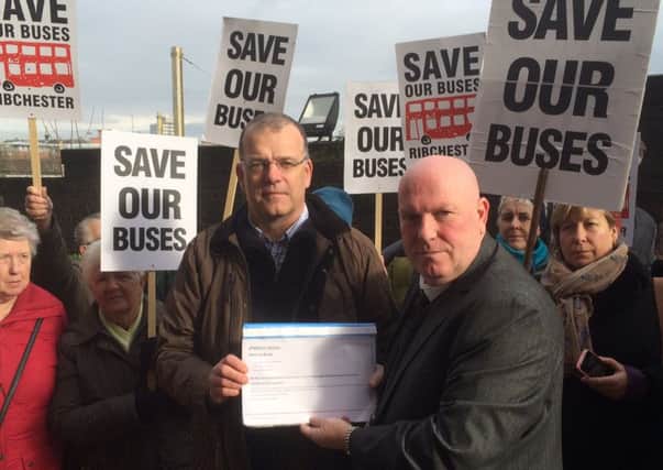 David Hudson, chairman of Save our Buses Ribchester presents protest petition to cabinet member Coun John Fillis at County Hall Preston