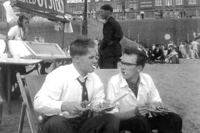 Eric and Little Ern the origianals, sat on Blackpool beach in front of the Tower in 1953
