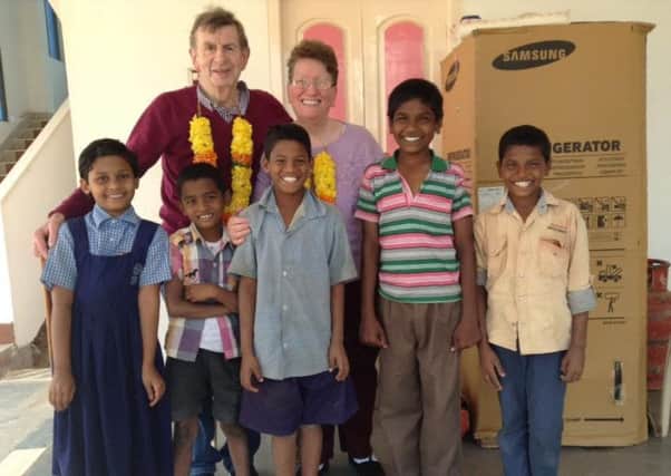 Carol and Leonard Fowler with the children they helped at a Tenali orphanage