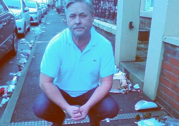John Gray on St Peter's Place, Fleetwood, where rubbish frequently blows onto the street.