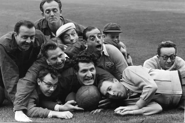 Stage and radio stars pictured during a training session for a football match at Bloomfield Road, Blackpool in aid of the Water Rats charities, in 1857.
 Front: Eric Morecambe, Ernie Wise, Tommy Cooper and Charlie Chester.
Back:- Kenny Baker, Stan Stennett, Jimmy Jewel, Ben Warriss, Kerry Jewel (Jimmy's son)  and Jeeves.