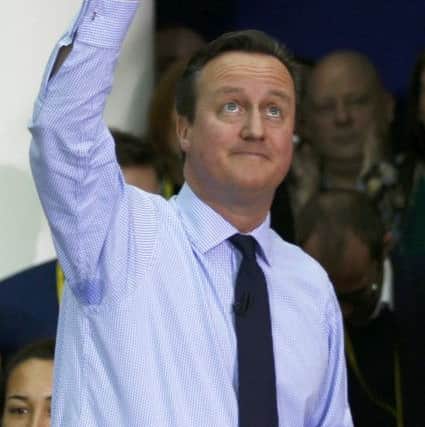 Prime Minister David Cameron waves after delivering a speech on the European Union