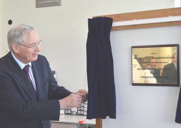 The Duke of Gloucester unveils at plaque at the national artificial eye service in Blackpool