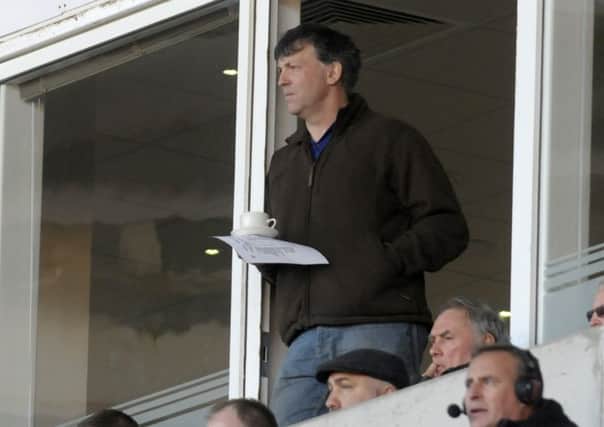 Karl Oyston watches Blackpool's reserves against Manchester United on Wednesday
