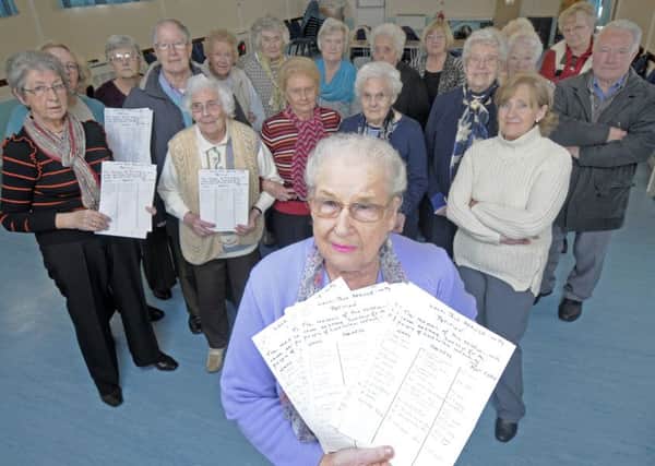 Bus service users at Larkholme Community Service have signed a petition against proposed bus cuts.  They are pictured with Norma Edwards holding the petition.