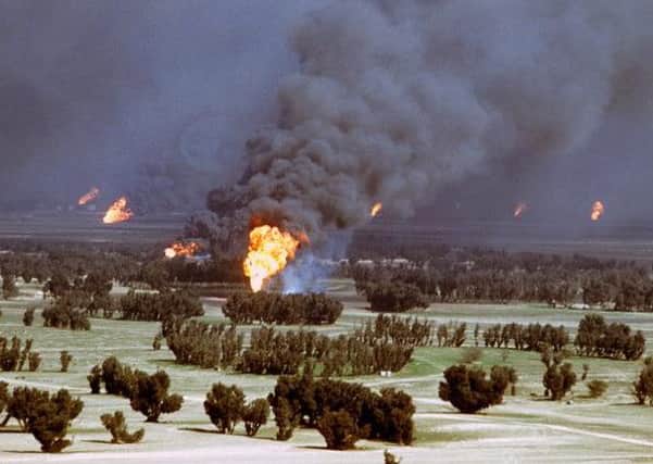 A Kuwaiti oil well set on fire by retreating Iraq troops during the Gulf War
