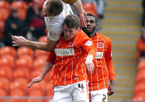 Blackpool's Jim McAlister vies for possession with Bradford City's James Hanson