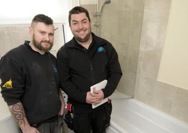 Pete Taylor and Sam Gaw from Complete Service Plumbing Ltd working on the shower after tracking down the man who was cheated out of a new bathroom