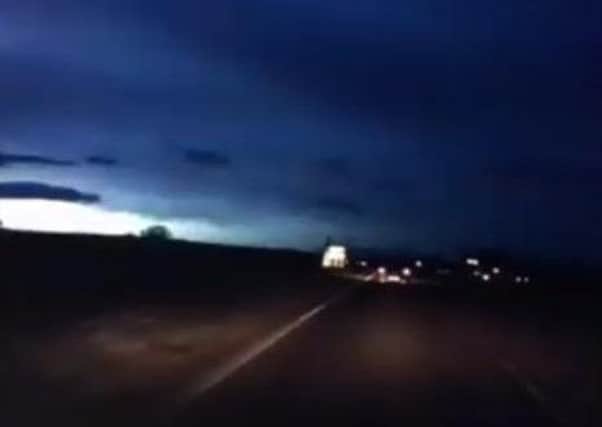 A still from the video of an apparent meteor.