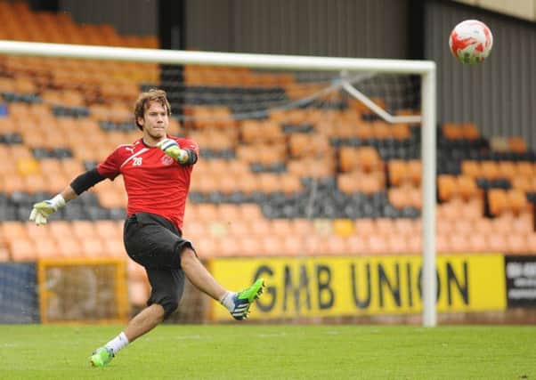 Fleetwood Town's Chris Maxwell during the pre-match warm-up at Port Vale