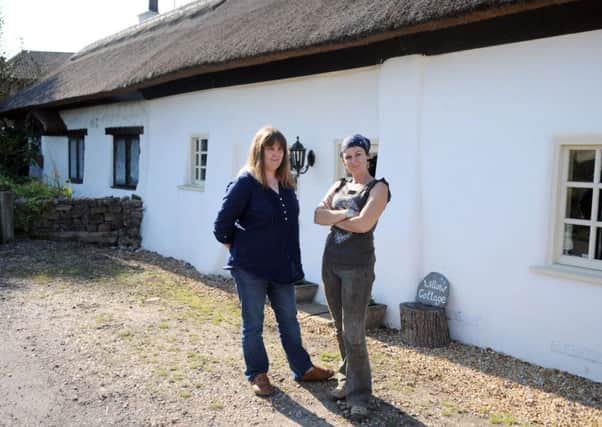 Residents Louise Brisco and Bev Lewis, protesting against plans to build 14 houses on land near their homes on Fishers Lane, Marton. The cottages are Grade II listed.