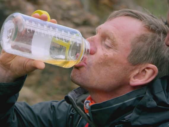 England football legend Stuart Pearce drinks his own wee in Bear Grylls: Mission Survive