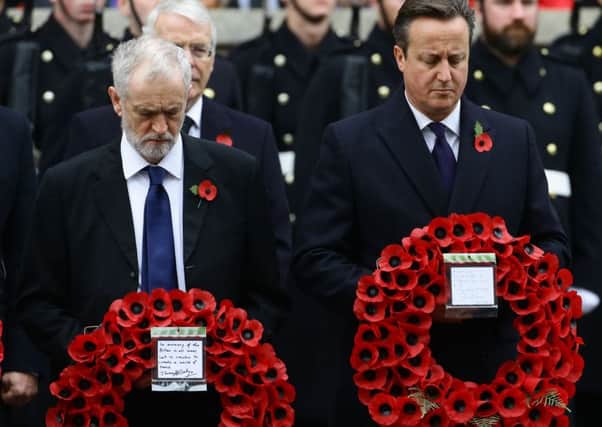 Labour party leader Jeremy Corbyn (left) and Prime Minister David Cameron wait to lay  wreaths during the annual Remembrance Sunday service at the Cenotaph memorial in Whitehall, central London, held in tribute for members of the armed forces who have died in major conflicts. PRESS ASSOCIATION Photo. Picture date: Sunday November 8, 2015. See PA story MEMORIAL Remembrance. Photo credit should read: Gareth Fuller/PA Wire
