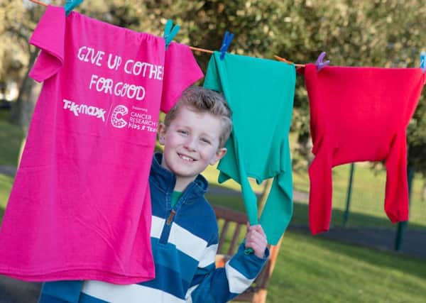 Hanging cancer out to dry: Nine year old, Joe Ball, from Lytham, who has been treated for leukaemia, is helping to beat childrens cancers sooner by supporting Cancer Research UK Kids & Teens and TK Maxxs Give Up Clothes for Good campaign.