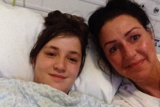 Penny Fawcett and her mum Abigail at Alder Hey children's hospital where Penny had an operation to give her a new navel.