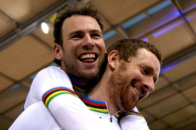 Sir Bradley Wiggins (right) and Mark Cavendish celebrate after winning the Mens Madison at the Track Cycling World Championships in London this month