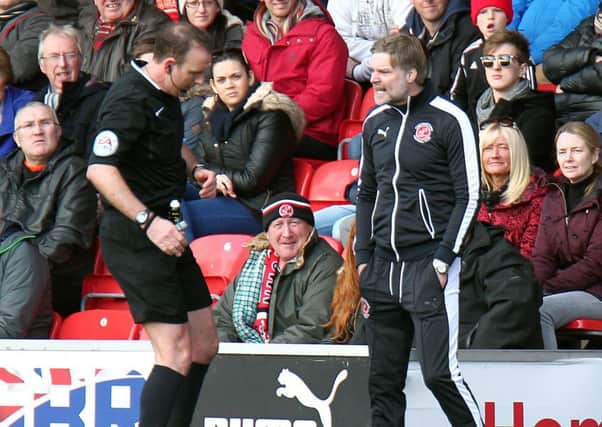Fleetwood Town manager Steven Pressley remonstrates with Referee Carl Boyeson in the dug-out during the first half  Photographer Rich Linley/CameraSport