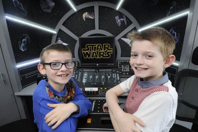 Dad Dave Bonney had built a Millennium Falcon entertainment centre in the bedroom of his two sons George, 8 and Dylan, 9.