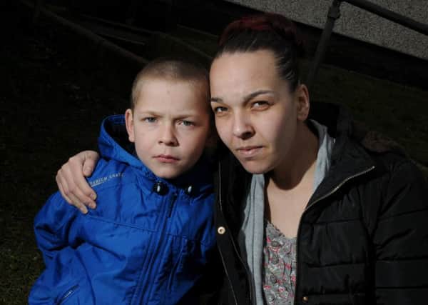 Lydia Sharman with son Adian, seven, from Blackpool, who were in a taxi when it crashed with a motorbike.
