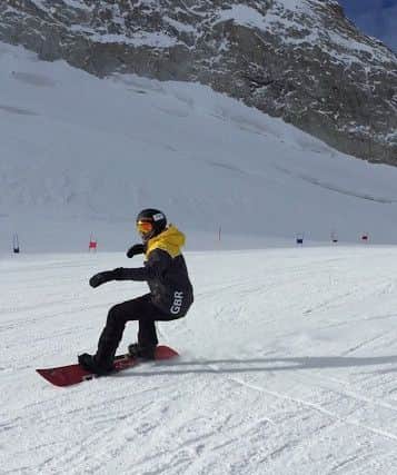 Bradley on his snowboard