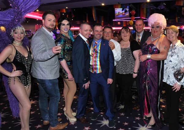 Pride organisers with drag queens and the Viva girls.