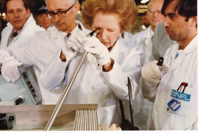 Margaret Thatcher inspects fuel pins during her site visit in 1985