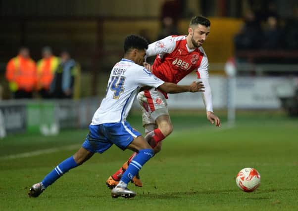 Fleetwood Town's Conor McLaughlin battles with Walsall's Rico Henry  Photographer Dave Howarth/CameraSport