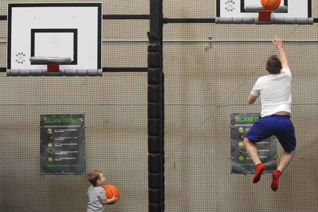 The Ascent indoor trampoline centre on Cornford Road in Marton was officially opened today by Blackpool boxing champion Brian Rose.
2 year-old Oliver Waling watches his dad Alistair slam dunk a basketball.