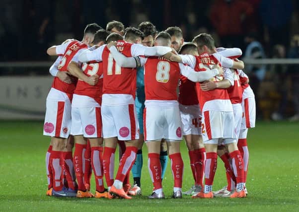 Fleetwood Town players in a huddle before the kick off against Walsall. Photographer Dave Howarth/CameraSport