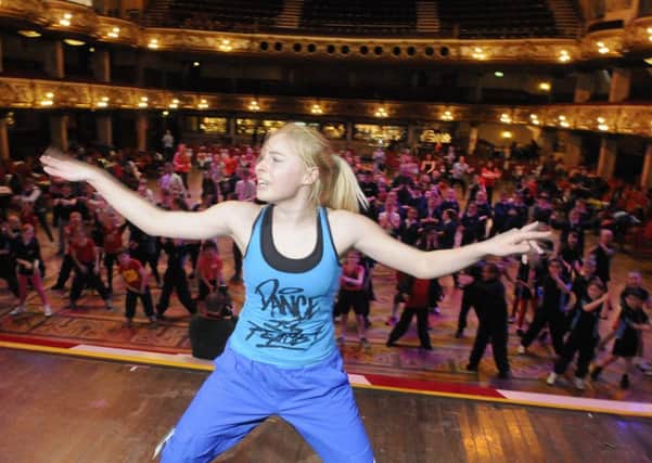 Children from Blackpool Primary schools take part in exercise for Sport Relief at Blackpool Tower.  One of the Zumba instructors leads the children.