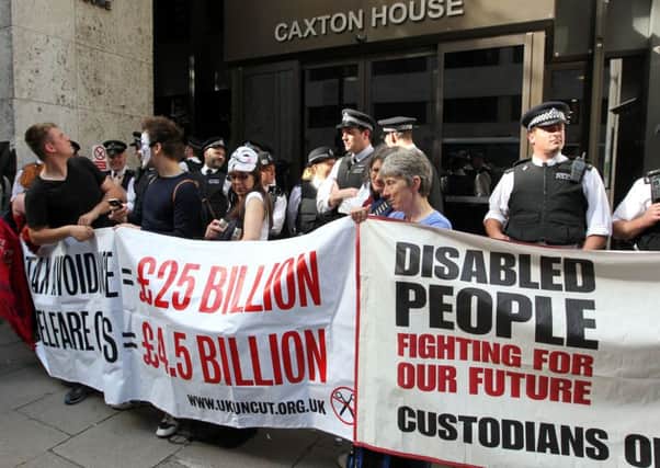 Demonstrators outside the offices of the Department of Work and Pensions in central London protesting against changes to disability benefit rules.