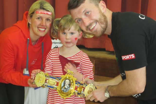 Rosa Hayes with boxer Scotty Cardle and teacher Nicola Wiseman at St Michaels School, Kirkham