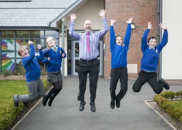 Pictured is headteacher Andy Mellor with Robyn Connell, Eden Robinson, David Cunningham and Alex Lloyd