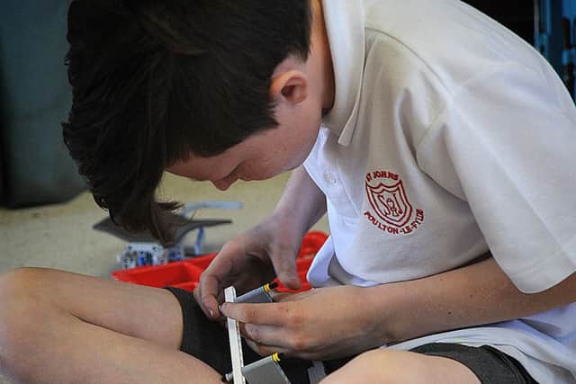 St. John's Primary in Poulton hosted a 'Robot Wars' style technology afternoon, which was organised by BAe Systems. 
Jack Beckett from St John's engrossed in a last-minute re-build.