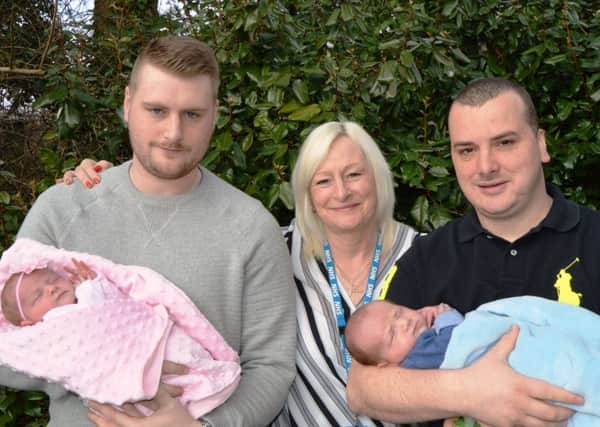 Matthew Smith holds his baby Millie Jayne accompanied by his mum Debbie Brearton and brother Philip Smith with his baby Henry at Blackpool Victoria Hospital