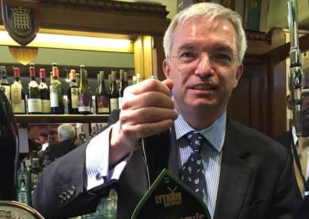 Mark Menzies pulls a pint of Lytham Brewery ale at Westminster