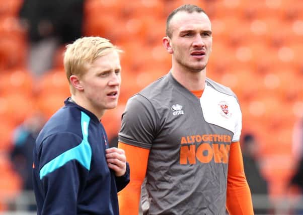 Blackpool's Mark Cullen (left) and Tom Aldred