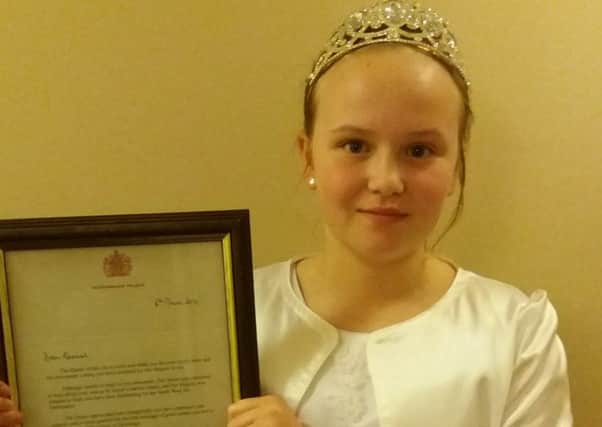 St Annes Carnival Queen Hannah Jeffrey with a letter received from Buckingham Palace after she wrote to The Queen
