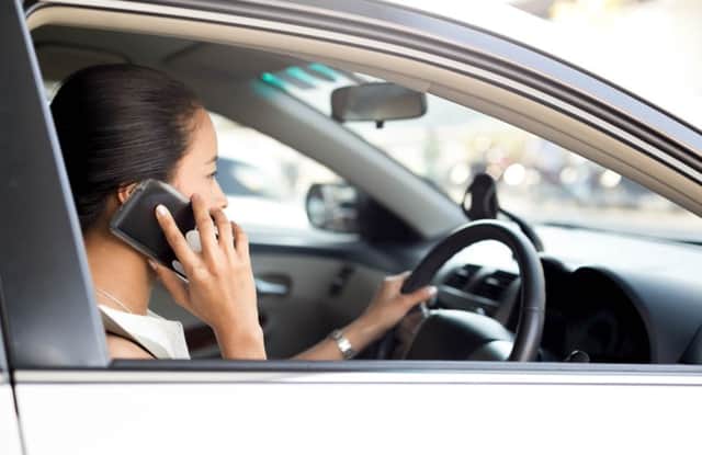 How many people do you see using their mobile phone while driving?