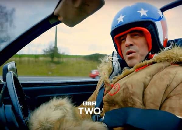 Matt LeBlanc  braves the cold on his way to Blackpool in an open-topped Robin Reliant
