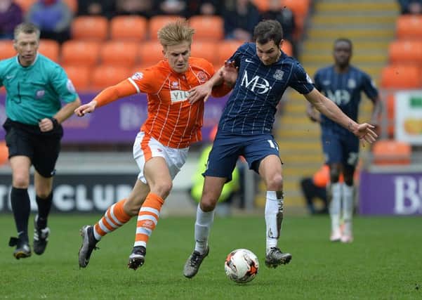 Blackpool's Brad Potts battles with Southend United's Will Atkinson