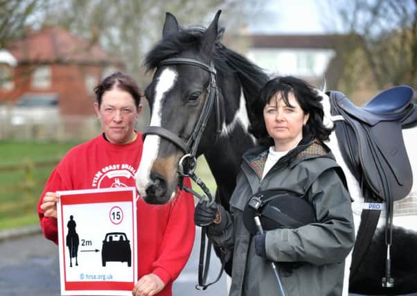 Picture by Julian Brown 03/04/16

Fylde Coast Bridleways Secretary Jill Broadhurst and equestrian Dawne Leach who have appealed for drivers to slow down while passing horses pictured at Cowburns Stables, Poulton, with the poster they hope will educate drivers and horse Phoenix