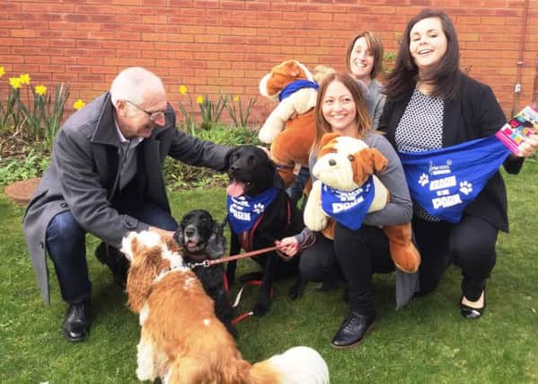 Canine chaos at Trinity Hospice ahead of Bark in the Park event
From left Dave Young with dogs Mason, Megan and Dexter and fundraisers Kimberlee Simmons from Blackpool, Linzi Young, and Antonia Hawkins from St Annes.
